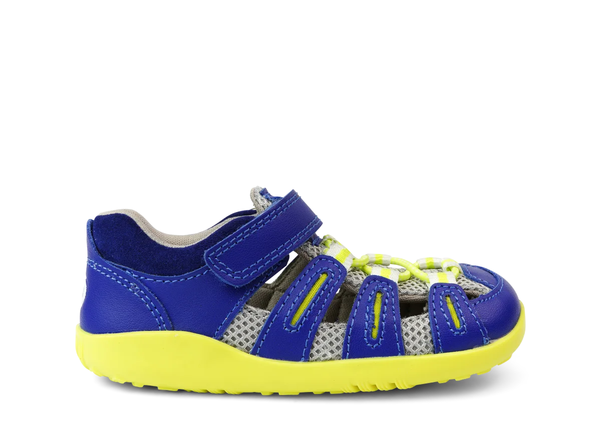 A unisex sandal by Bobux, style Summit,in blue leather/microfibre with neon yellow sole and trim and velcro/elastic fastening. Right side view.
