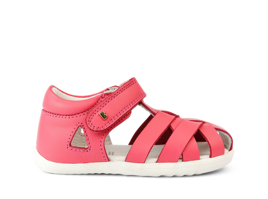 A girls open toe sandal by Bobux, style Tropicana in bright pink with velcro fastening. Right side view.