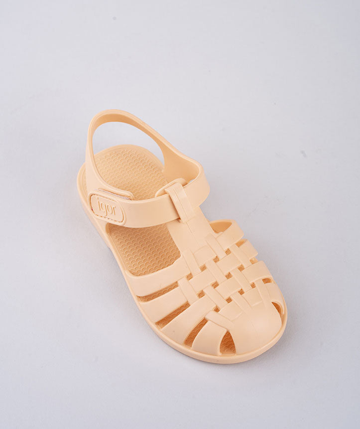 A unisex closed toe sandal by Igor,style Clasica, pastel orange with velcro fastening. Above view.