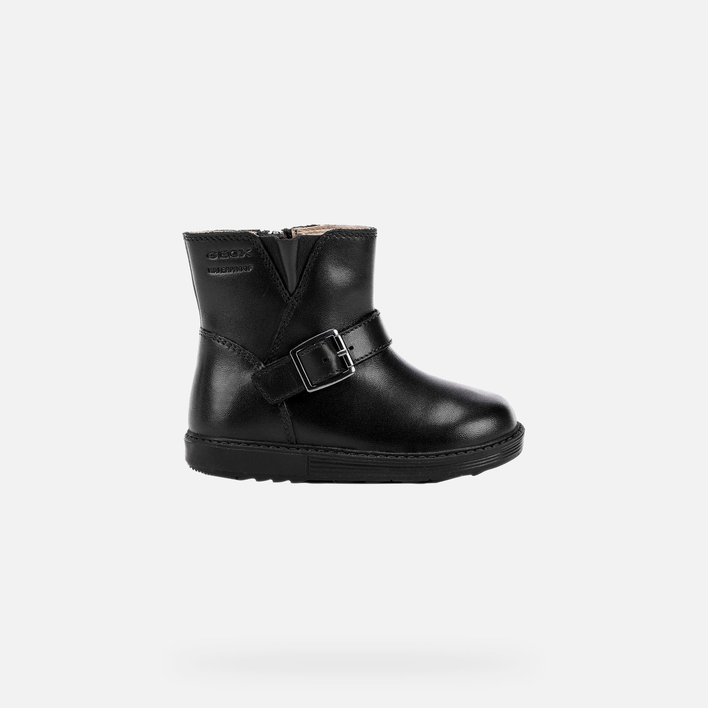 A girls waterproof ankle boot by Geox, style is Hynde in Black leather with zip side fastening and buckle across the top to alter width. Right side view.