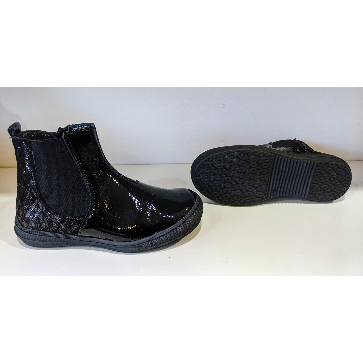 A girls ankle boot by Bopy, style Sylvaine, in black with zip fastening. Left side view.