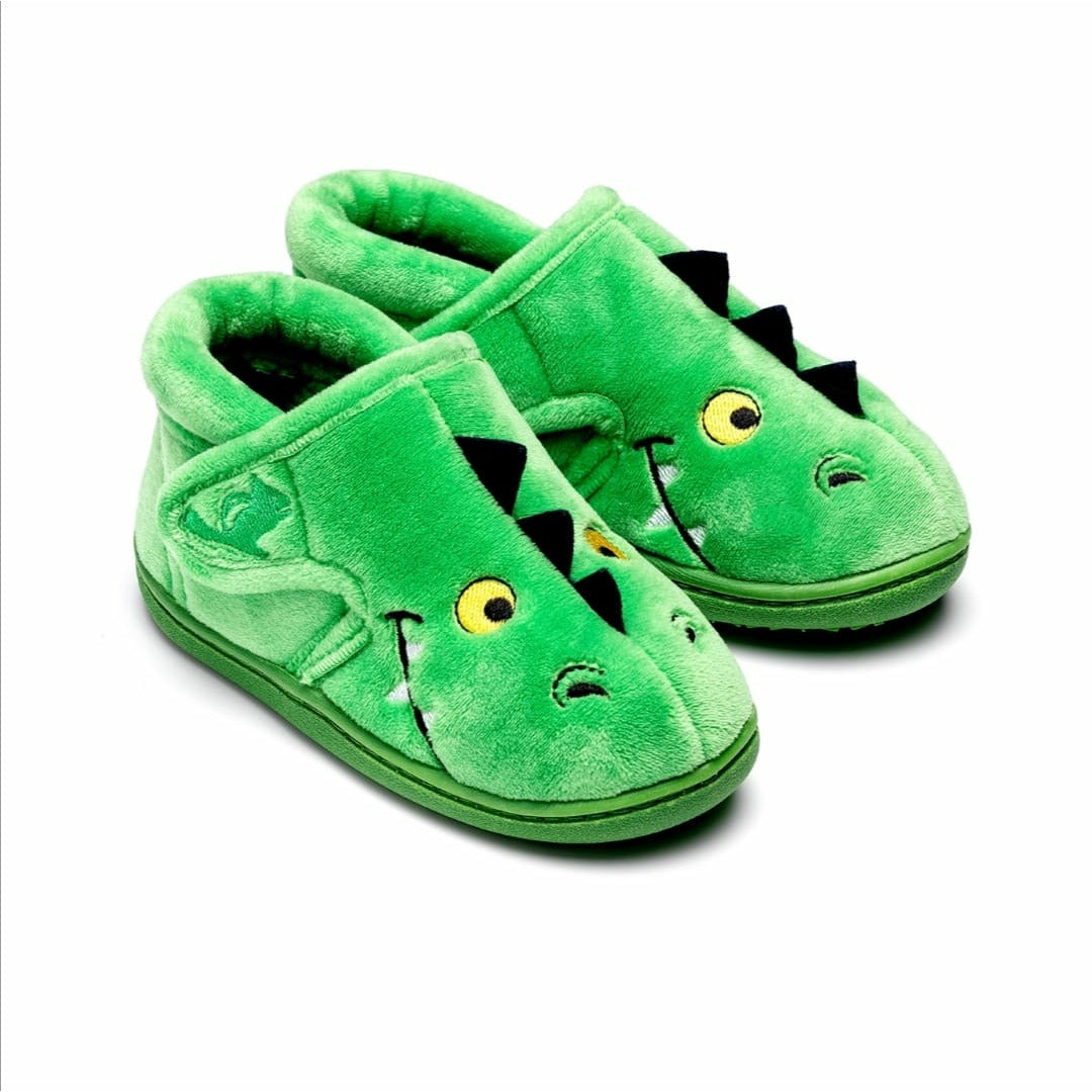 A pair of unisex slippers by Chipmunks, style Scorch in green with dinosaur face and velcro fastening. Angled view.