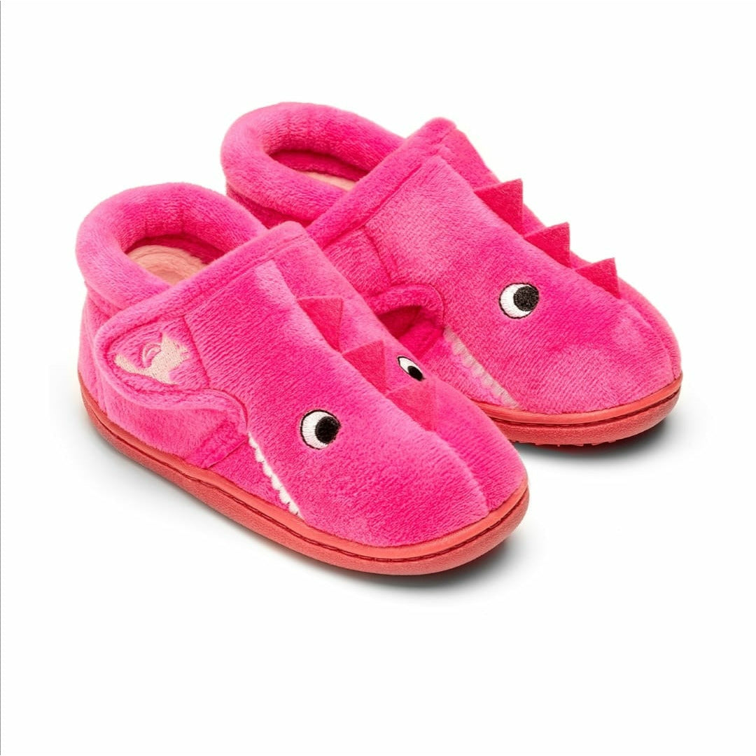 A pair of girls slippers by Chipmunks, style Daniela, in pink dinosaur design and velcro fastening. Angled view.