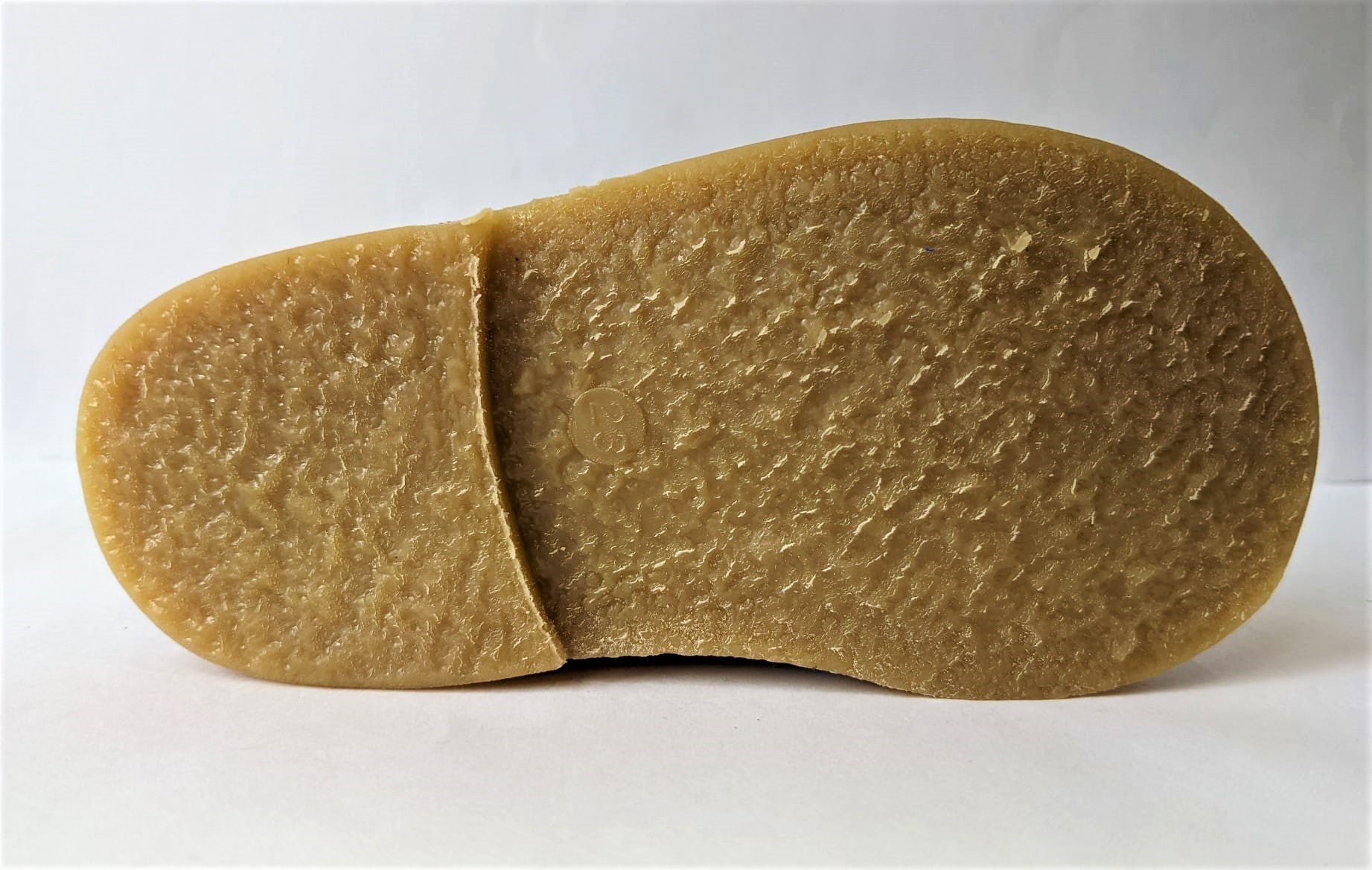 A girls lace up  boot by Petasil, style Kent, in pink leather with lace and zip fastening. Sole view.