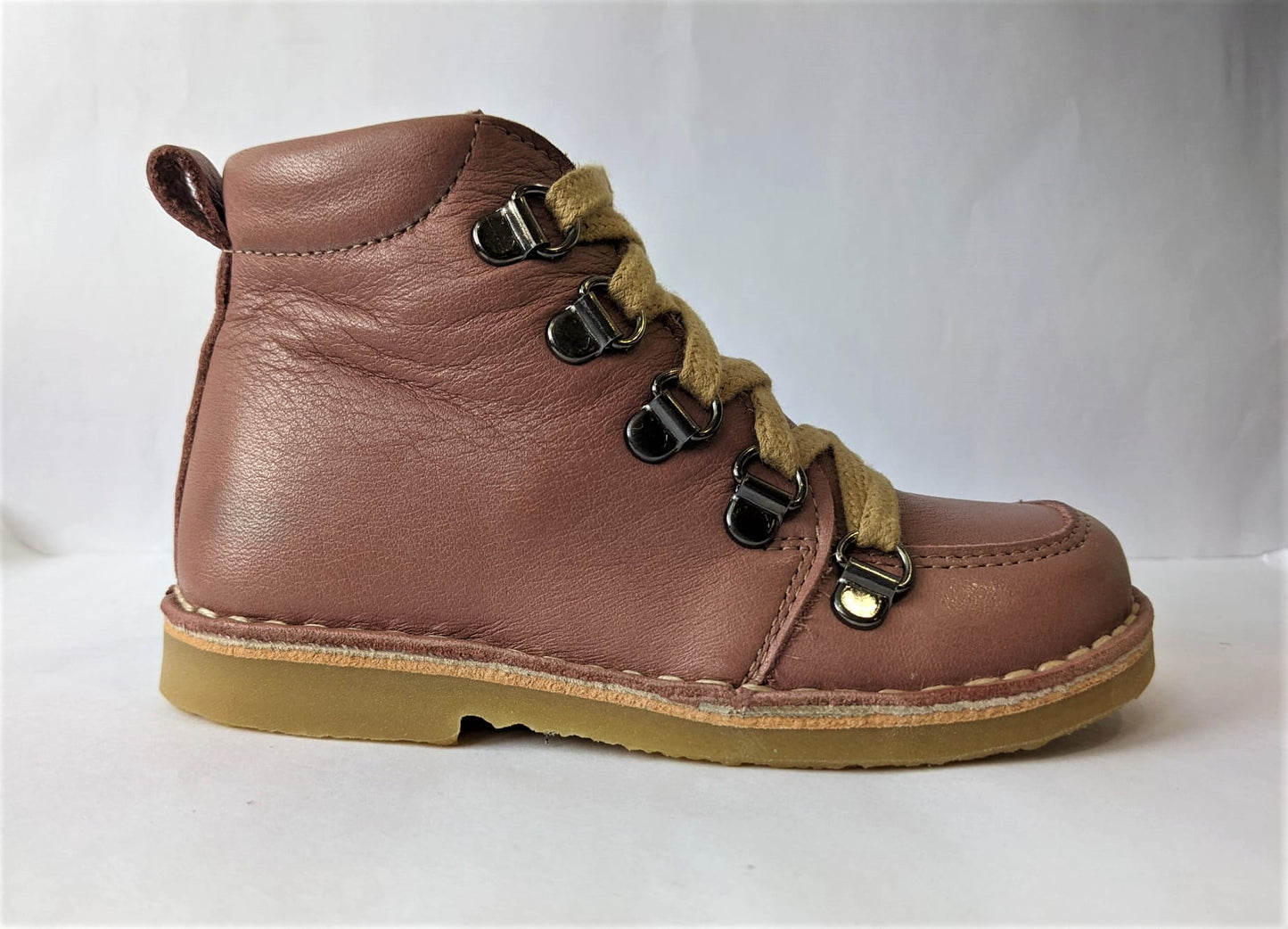 A girls lace up  boot by Petasil, style Kent, in pink leather with lace fastening. Right side view.