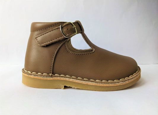 A girls T-Bar shoe by Petasil, style Cooper, in light brown with faux buckle fastening. Right side view.