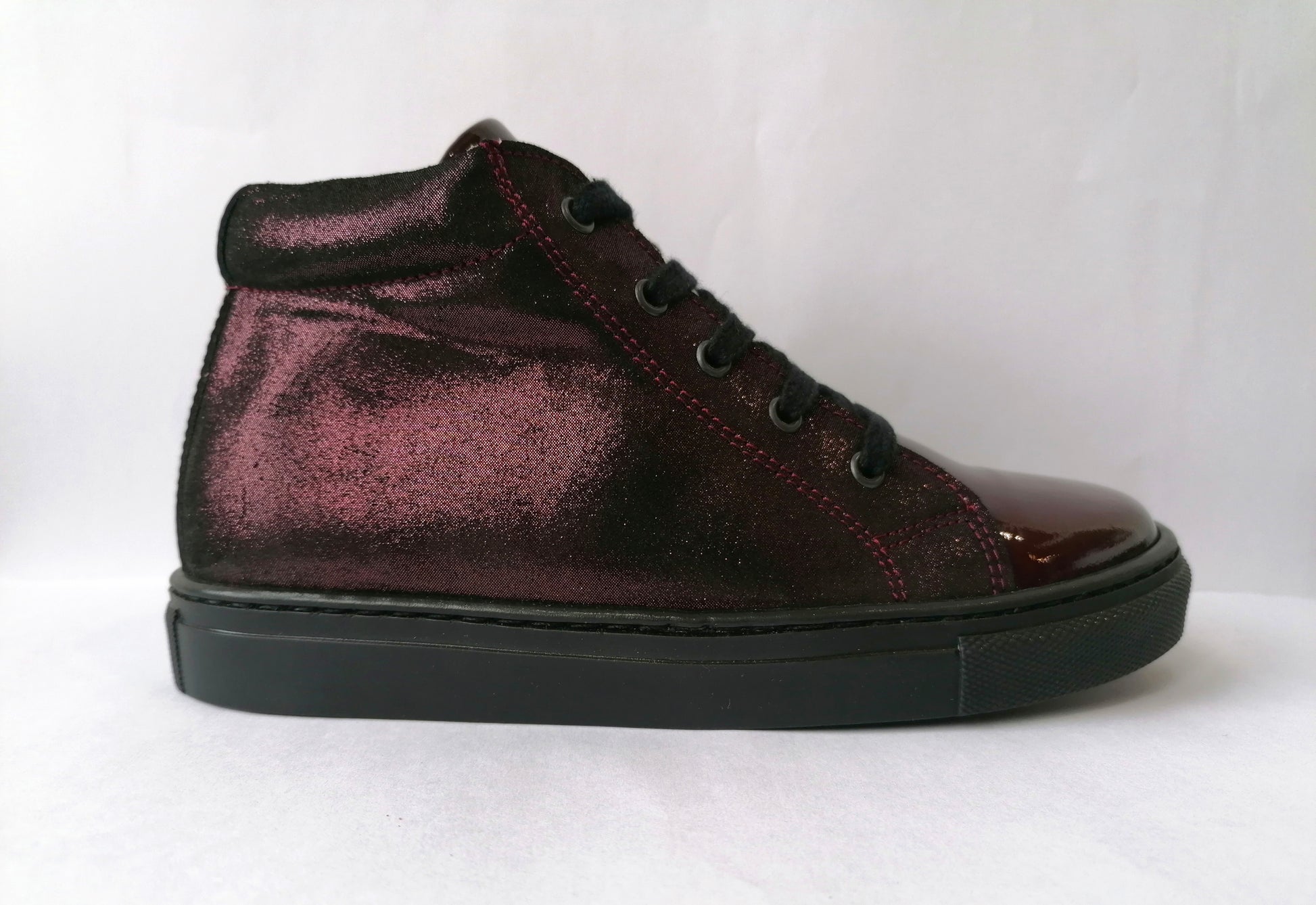 A girls casual boot by Petasil, style Gracie 2, in burgundy patent and glitter nubuck with lace and zip fastening. Right side view.