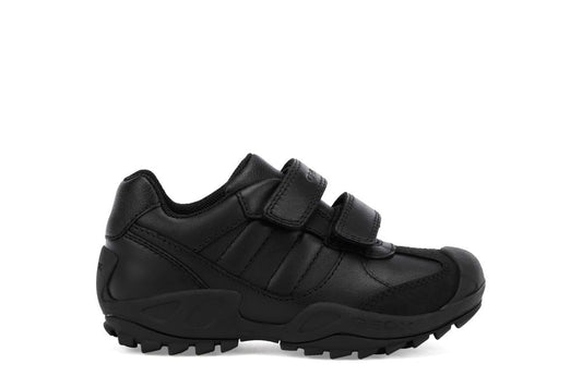 A casual boys school shoe by Geox, style New Savage, in black with double velcro fastening. Right side view.