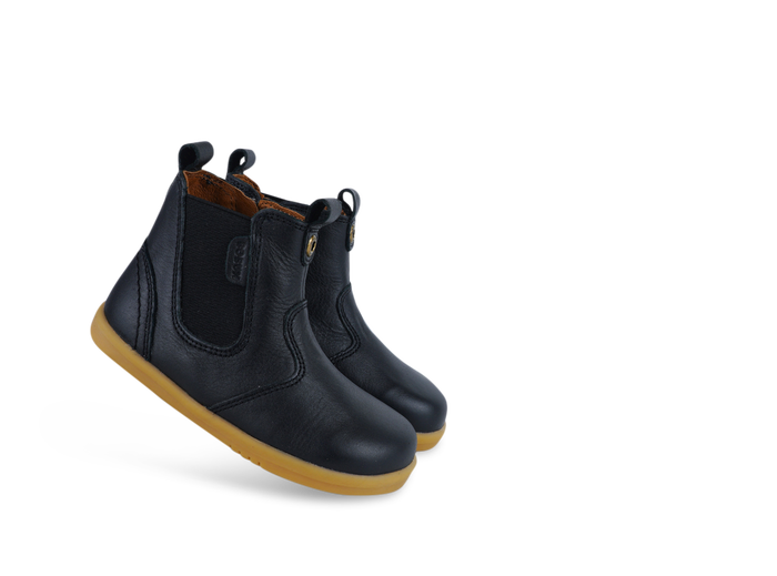 A pair of unisex zip Chelsea boots by Bobux, style KP Jodphur, in black leather with zip fastening. Angled view.