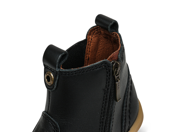 A unisex zip Chelsea boot by Bobux, style KP Jodphur, in black leather with zip fastening. Close up of ankle.