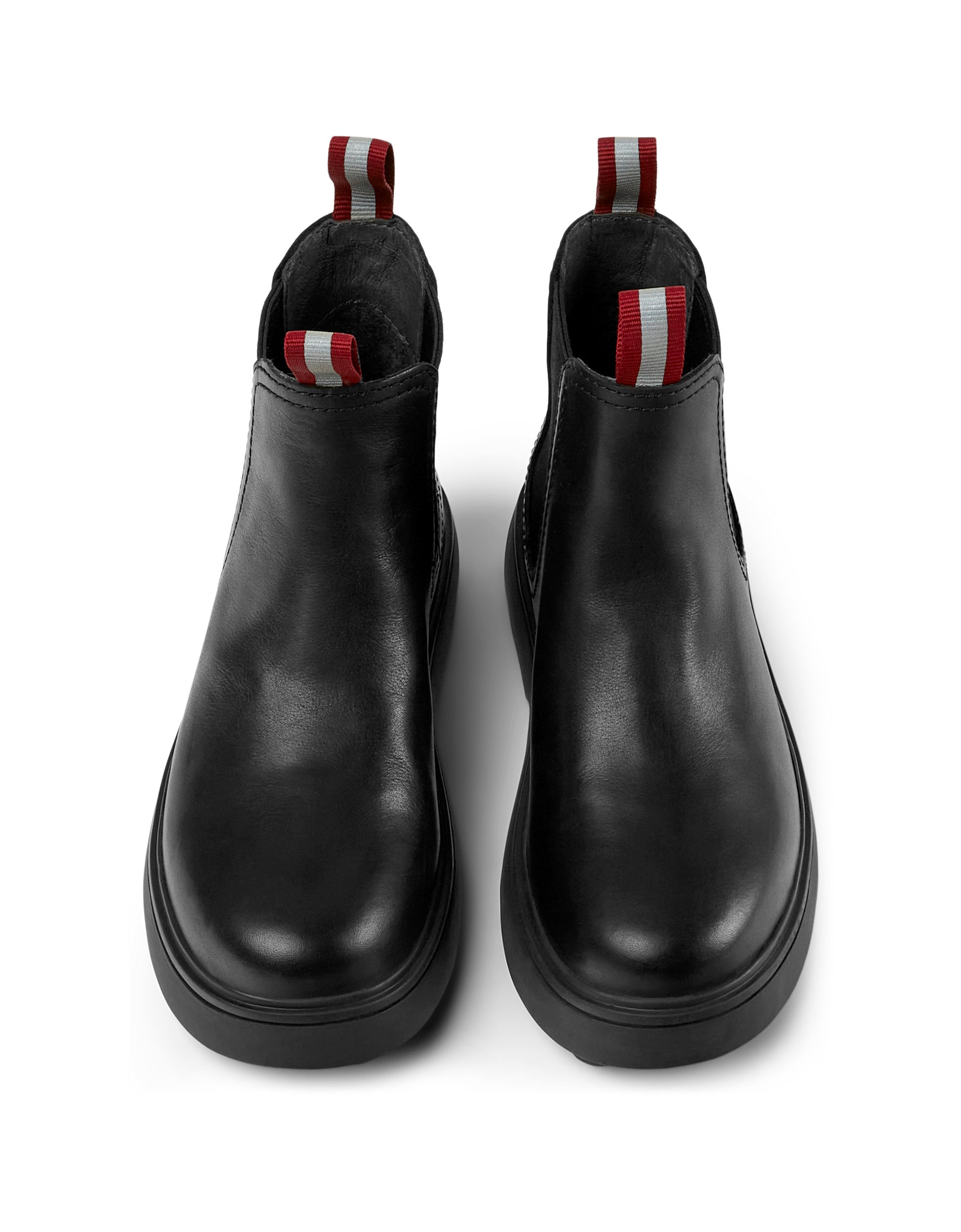 A pair of girls chunky chelsea boots by Camper, style K900149-001,in black leather,pull on style. Above view.