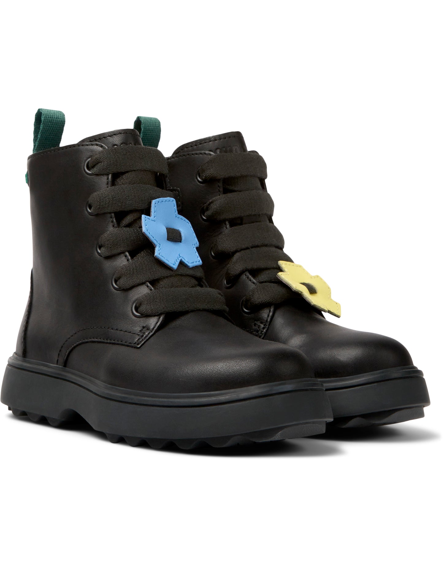 A girls chunky ankle boot by Camper, style K900150-012,in black leather with zip and lace fastening showing flowers on laces. Angled view.