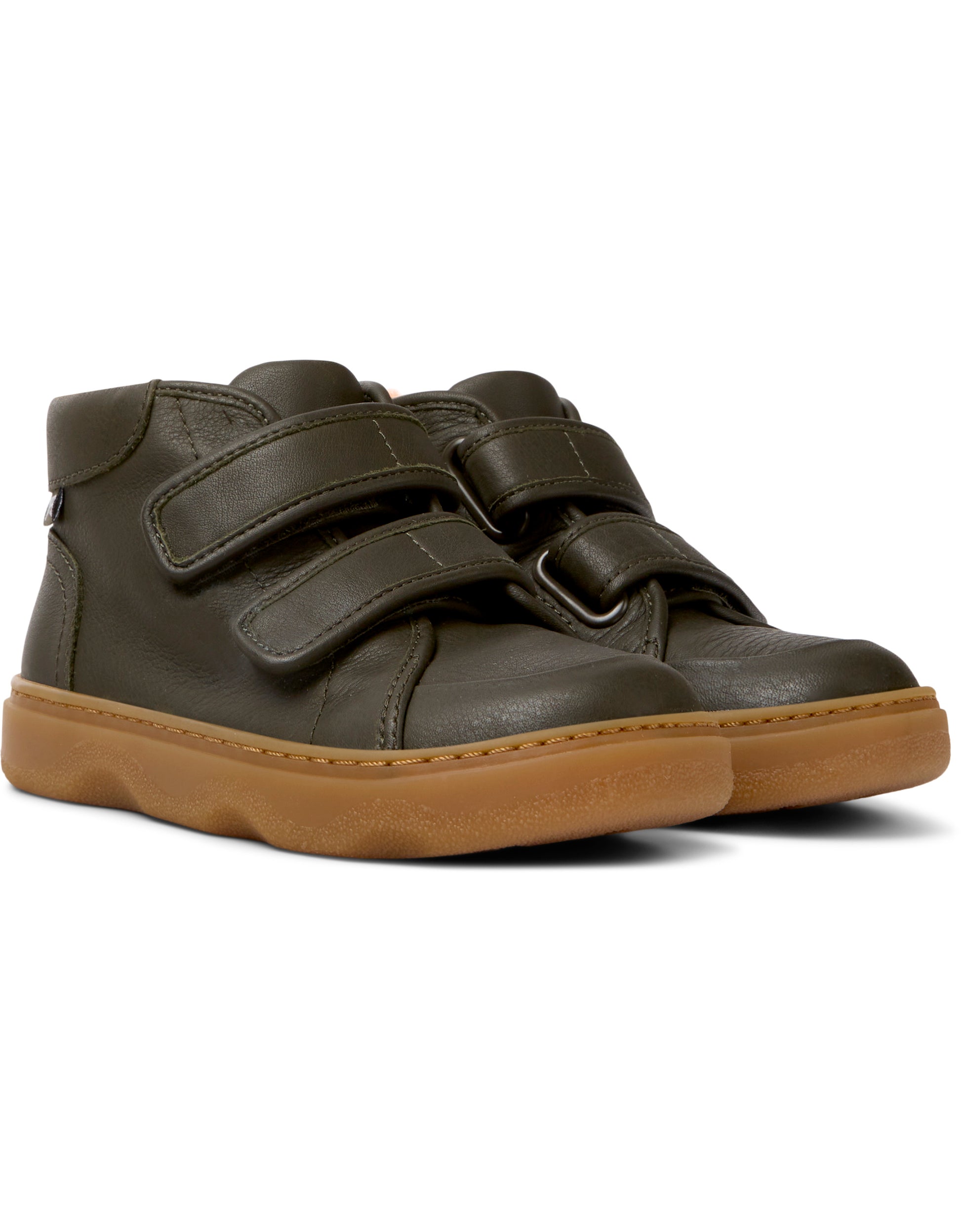 A pair of boys casual ankle boots by Camper, style K900303-004 in brown leather with double velcro fastening. Angled view.