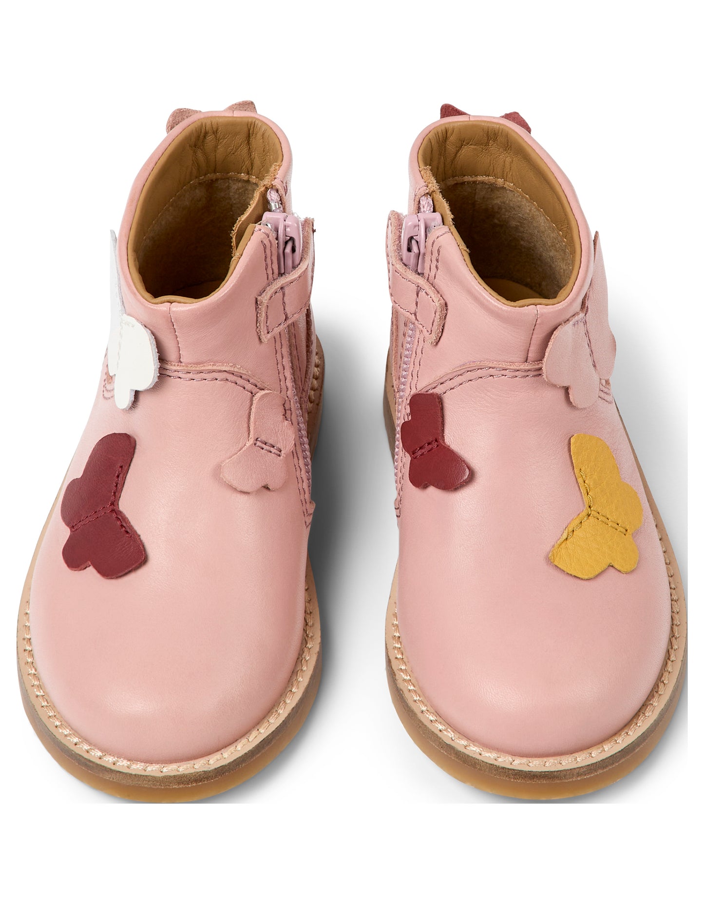 A pair of girls butterfly detail ankle boot by Camper, style K900316-001, in pink with zip fastening. Above view.