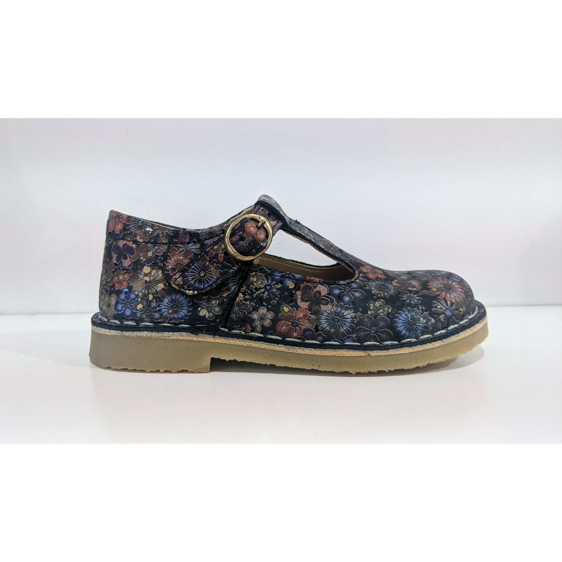 A girls T-Bar shoe by Petasil,style Crosspatch, in bronze floral leather with buckle fastening. Right side view.