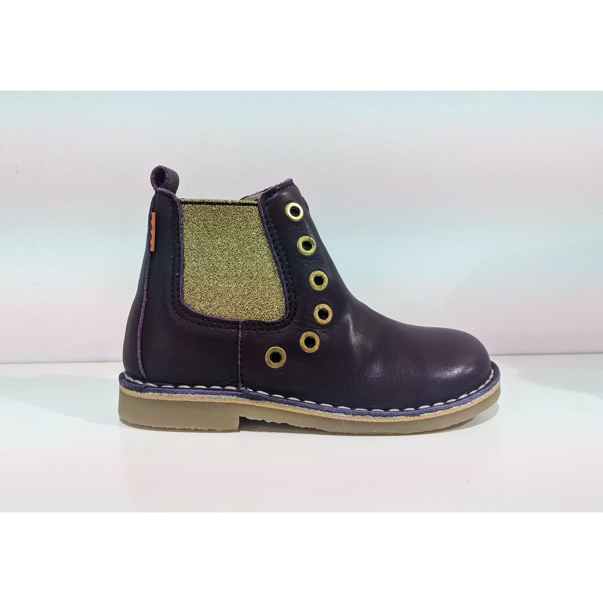 A girls chelsea boot by Petasil, style Alison, in purple and gold with zip fastening. Right side view.