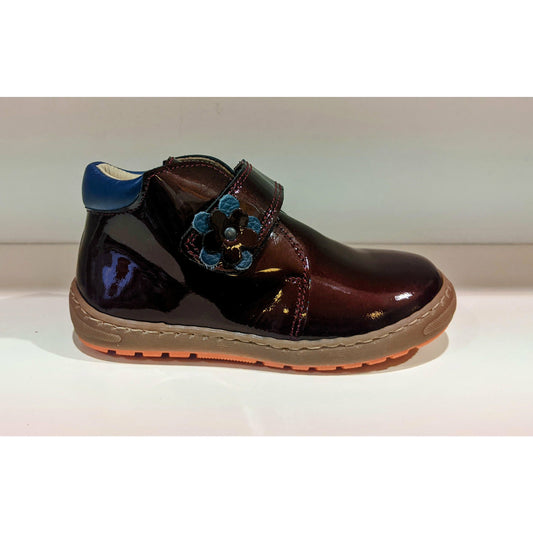 A girls ankle boot by Petasil, style Denise, in Burgundy patent with velcro fastening. Right side view.