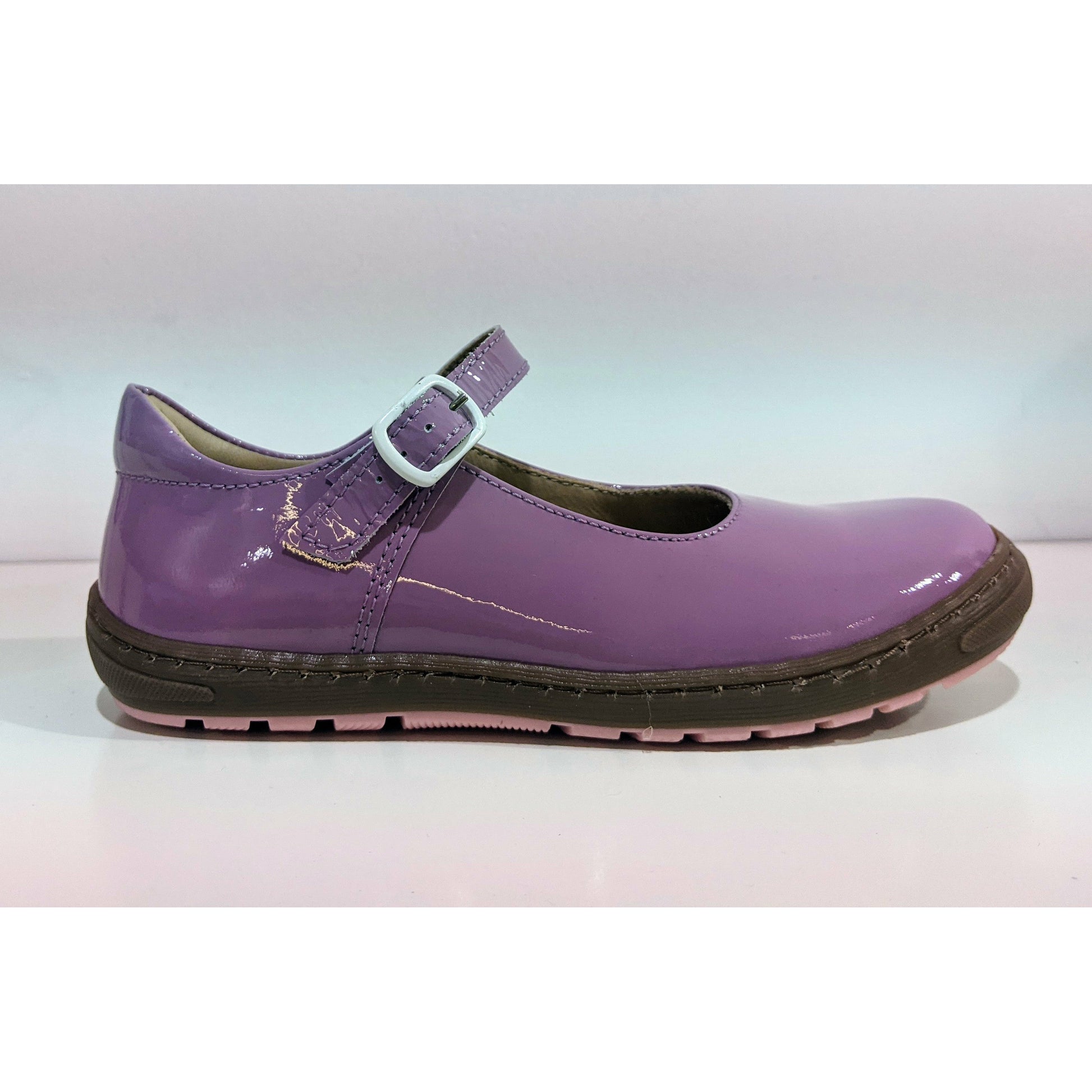 A girls Mary Jane shoe by Petasil ,style Joana, in lilac patent with buckle fastening. Right side view.