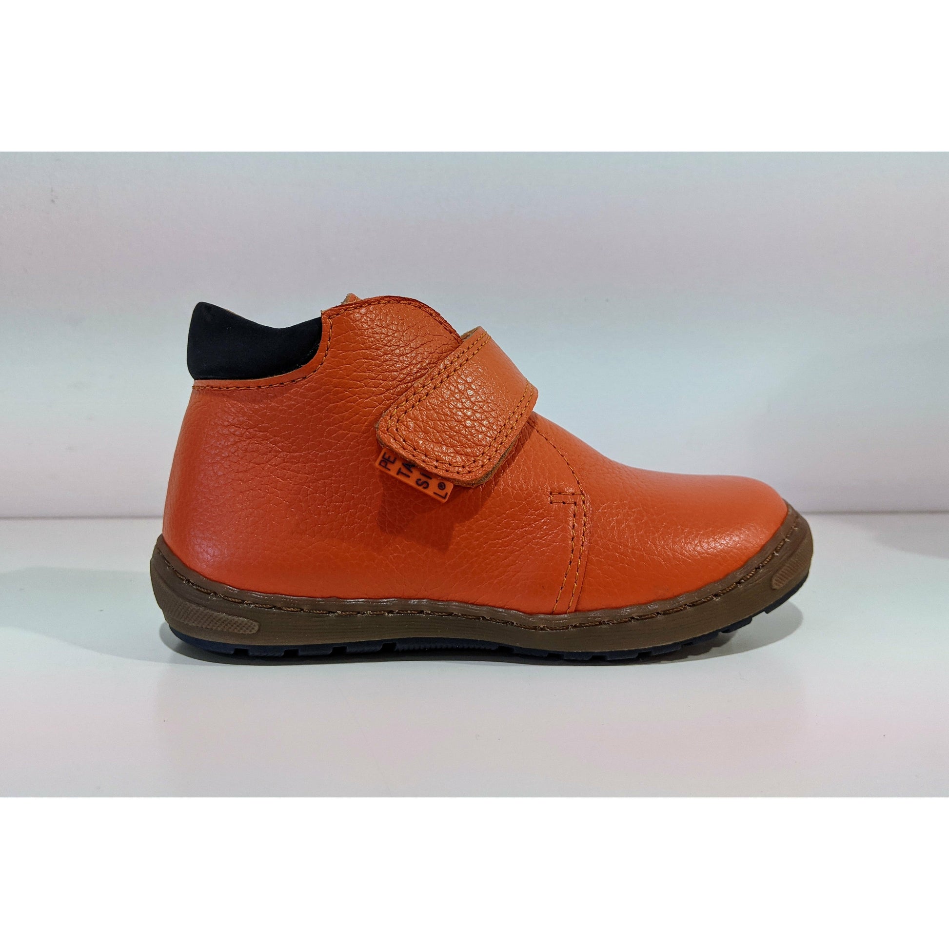 A boys ankle boot by Petasil, style Jason, in orange with velcro fastening. Right side view.