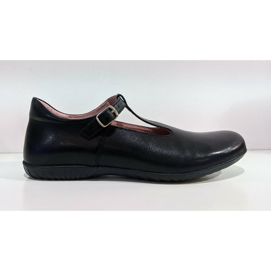 A girls T-Bar school shoe by Petasil, style Emel, in black with buckle fastening. Right side view.
