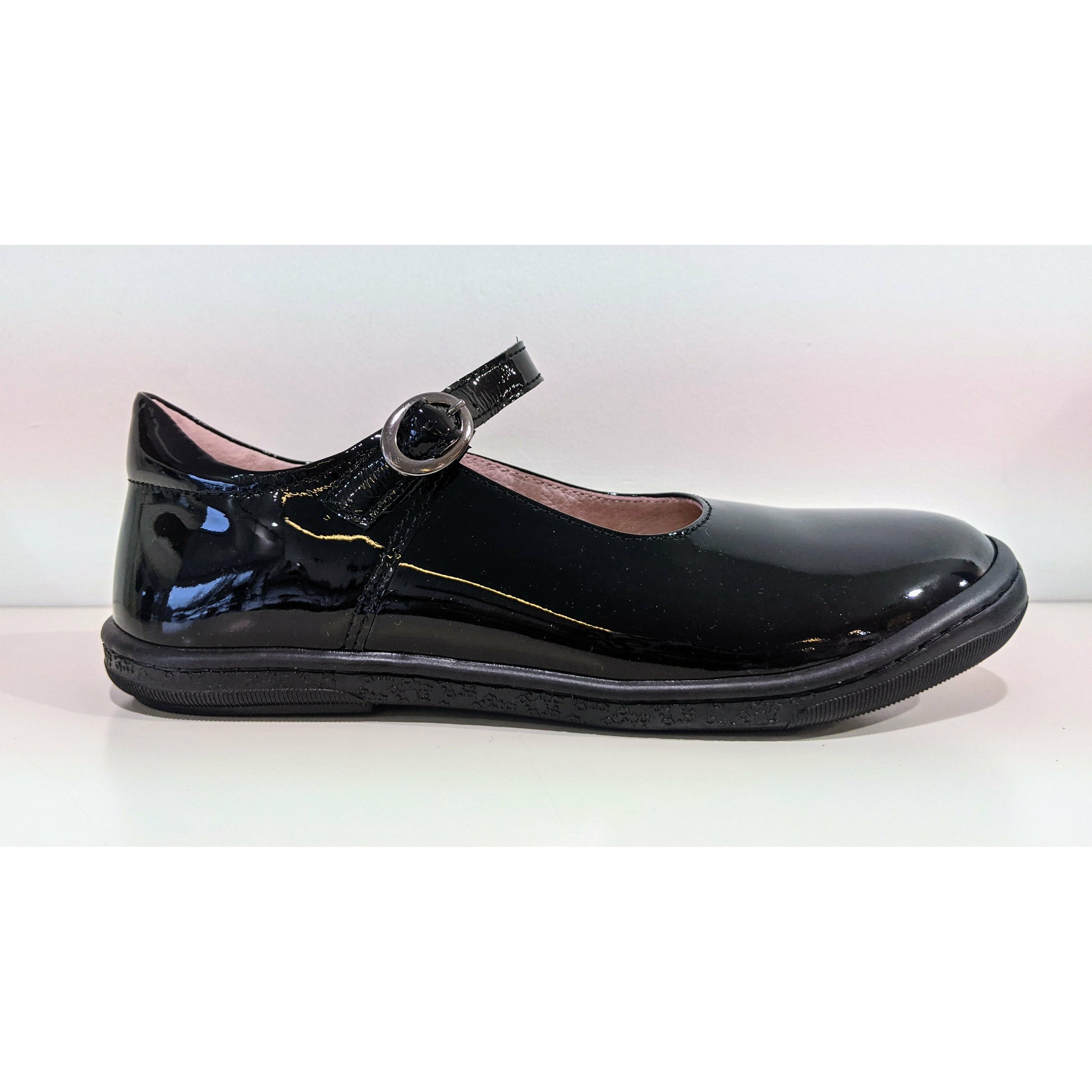 A girls Mary Jane school shoe by Petasil, style Balbina, in black with buckle fastening. Right side view.