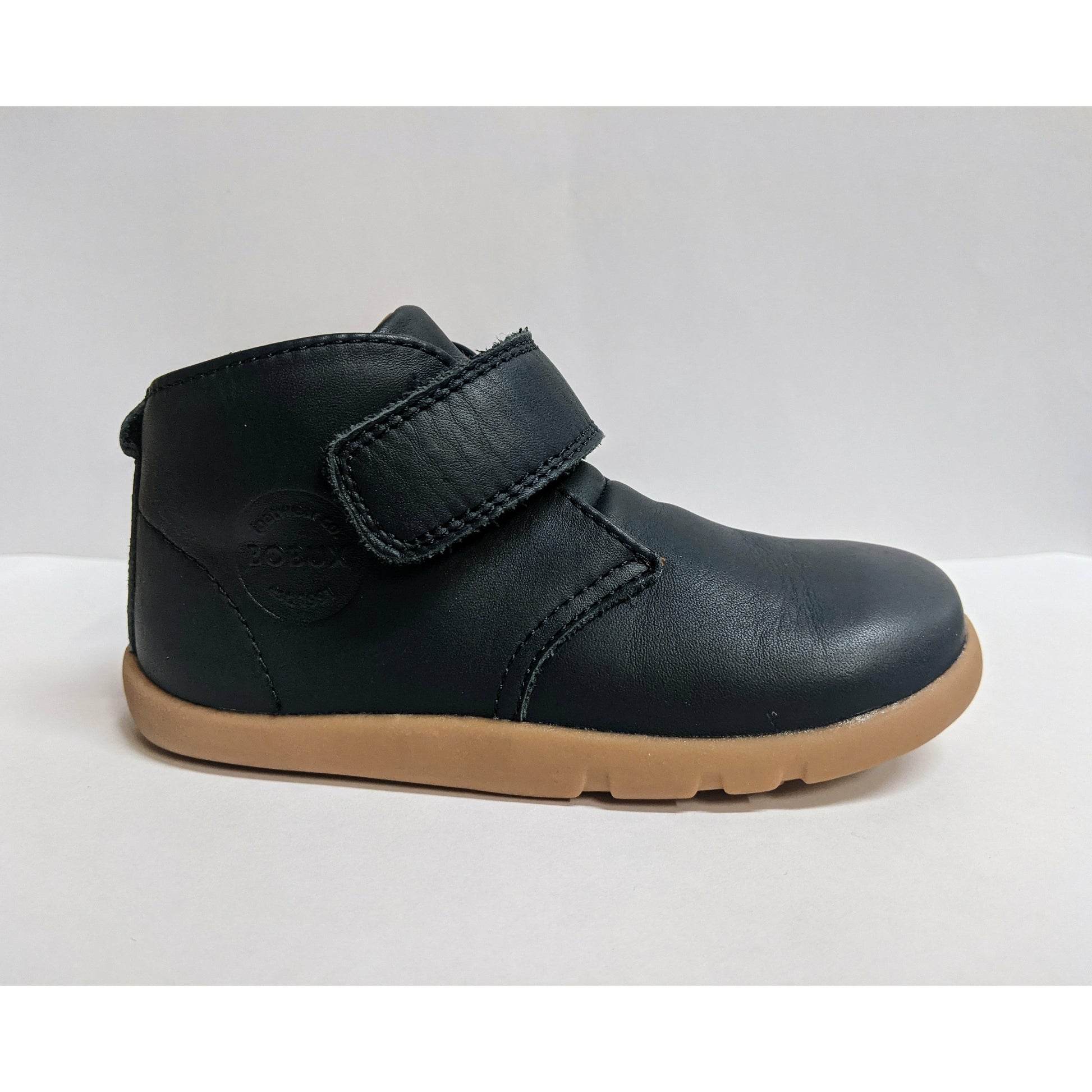 A boys ankle boot by Bobux,style Desert,in Navy with velcro fastening.