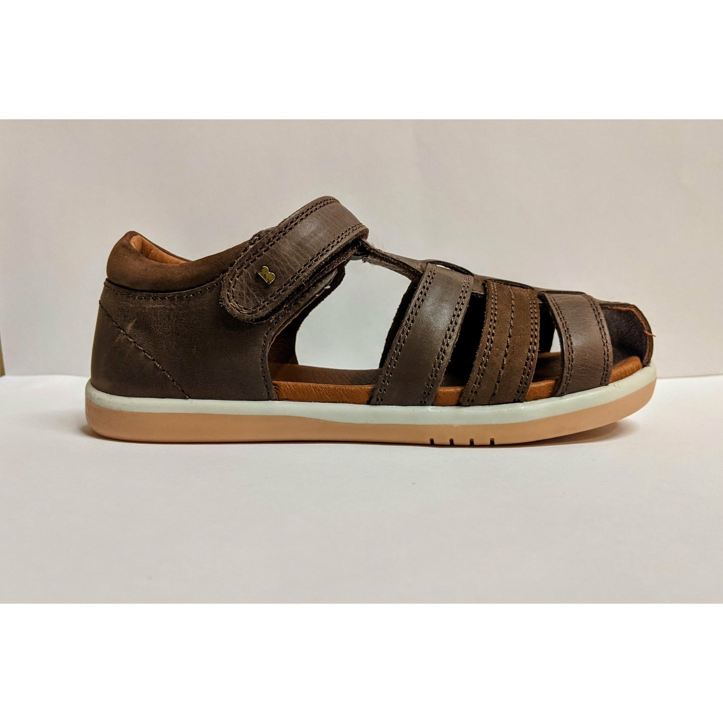 A boys brown closed toe sandal by Bobux,style Roam,in brown with velcro fastening. Right side view.
