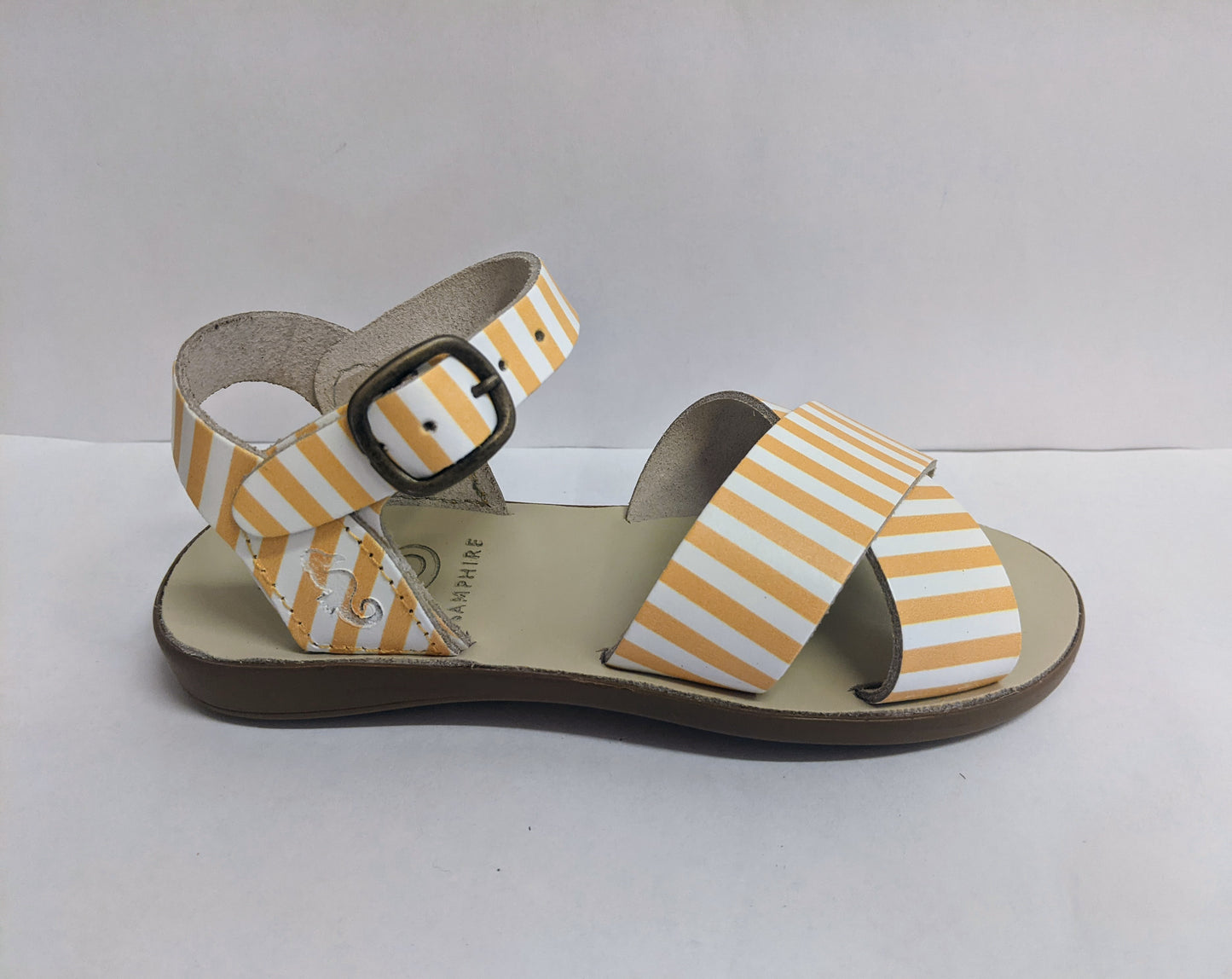 A girls sandal by Petasil Samphire,style Jamina, in yellow and white with buckle fastening. Right side view.