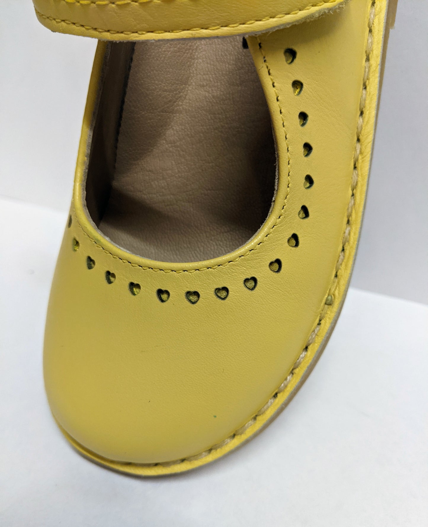 A girls Mary Jane shoe by Petasil,style Nadia, in yellow with velcro fastening. Above view.