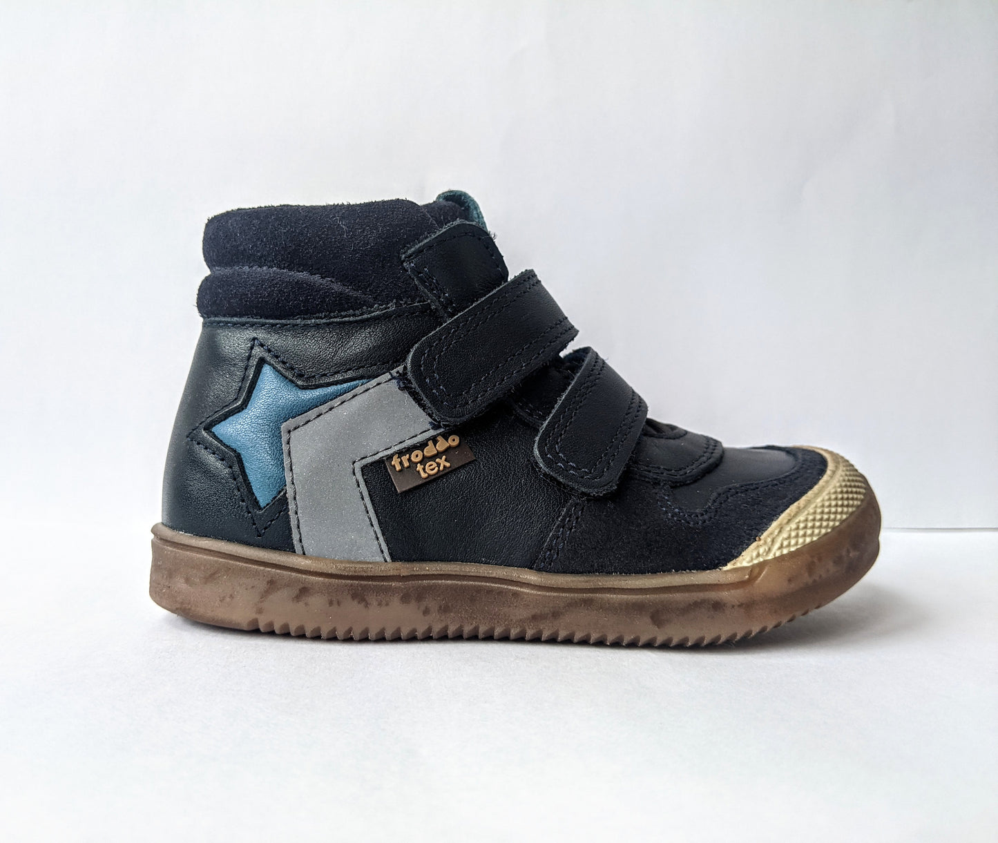 A boys casual boot by Froddo, style G2110083, in Navy and blue leather and nubuck with double velcro fastening. Right side view.