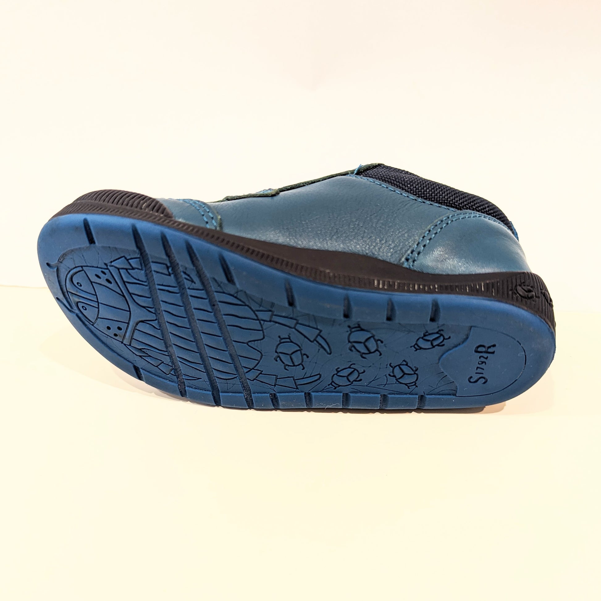 A boys casual shoe by Start Rite, style Tickle, in teal leather with double velcro fastening. Sole view.