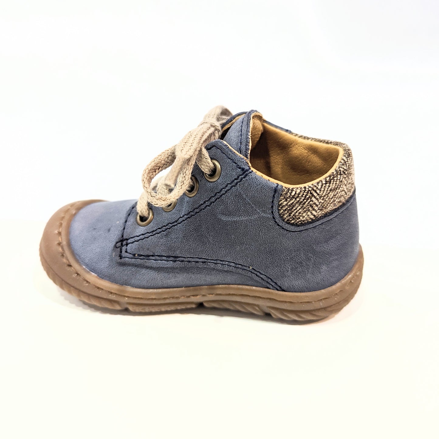 A boys ankle boot by Bopy ,style Jazo, in marine blue with lace and side zip fastening. Left side view.