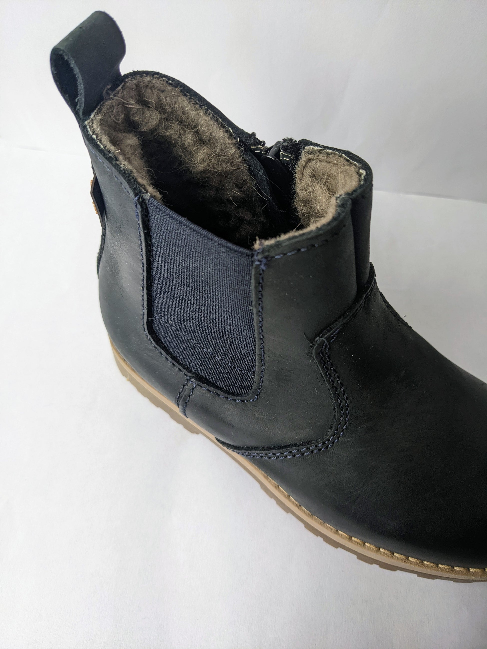 A fur lined unisex ankle boot by Froddo, style G3160111, in dark Blue nubuck with zip fastening. Above view of fur lining and right side