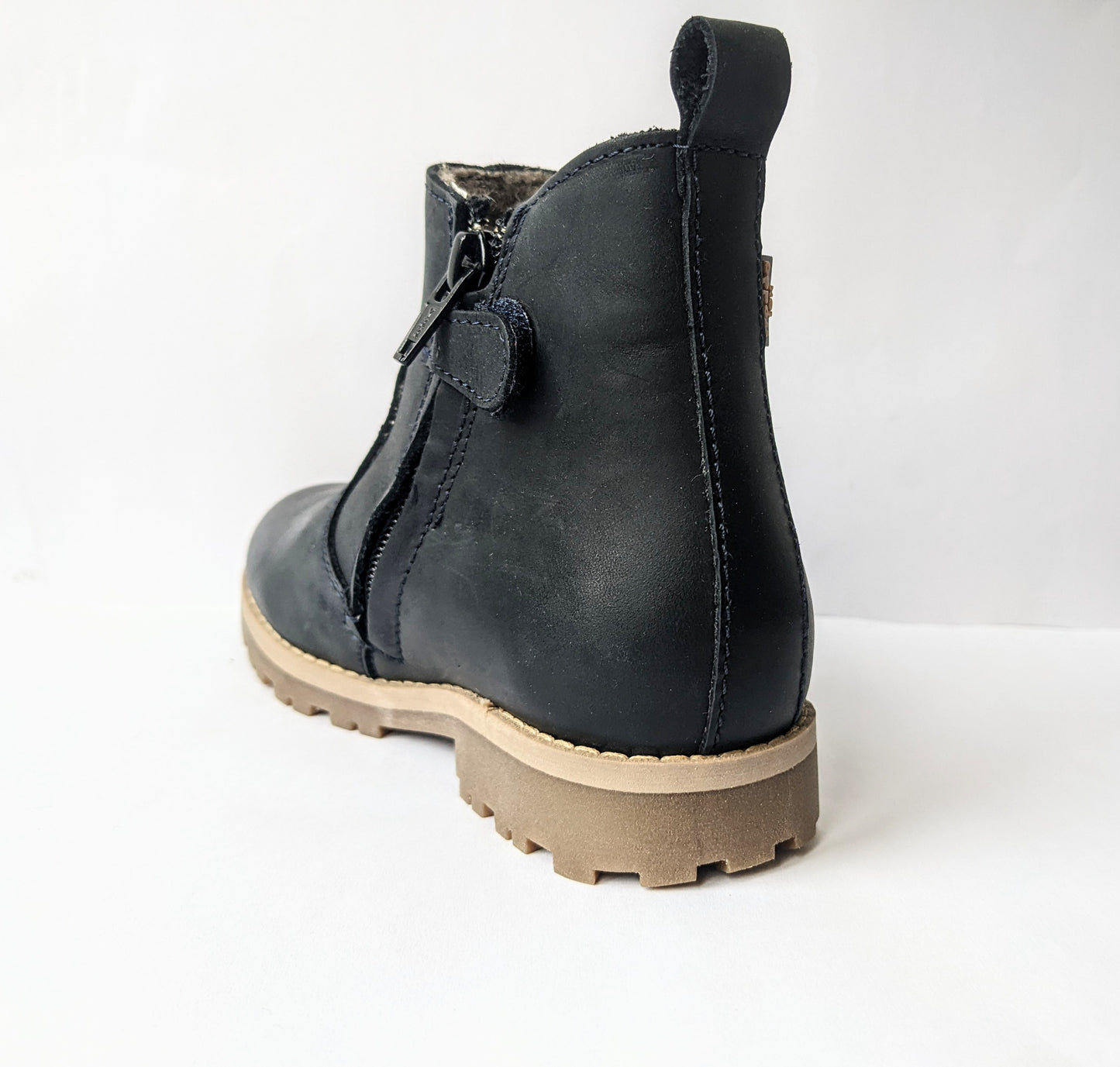 A fur lined unisex ankle boot by Froddo, style G3160111, in dark Blue nubuck with zip fastening. Back view