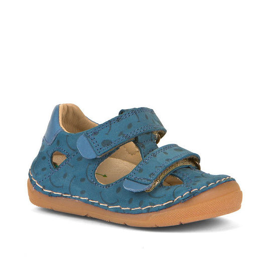 A boys closed toe sandal by Froddo, style Paix Double, in blue nubuck with double velcro fastening. Angled view.