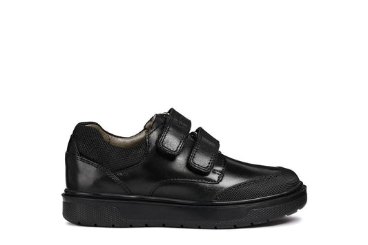 A boys smart school shoe by Geox, style Riddock,in black with double velcro fastening. Right side view.