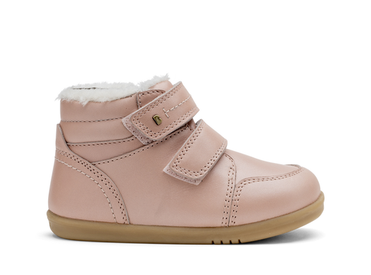 A girls waterproof fur lined ankle boot by Bobux,style Timber, in pale pink with double velcro fastening. Right side view.