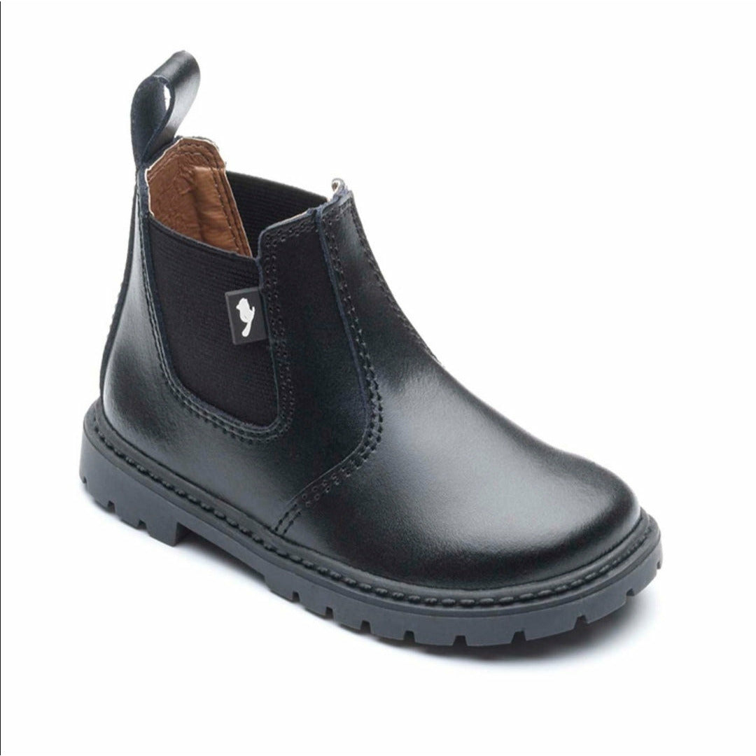A chelsea boot by Chipmunks,style Ranch, in black leather. Angled view.