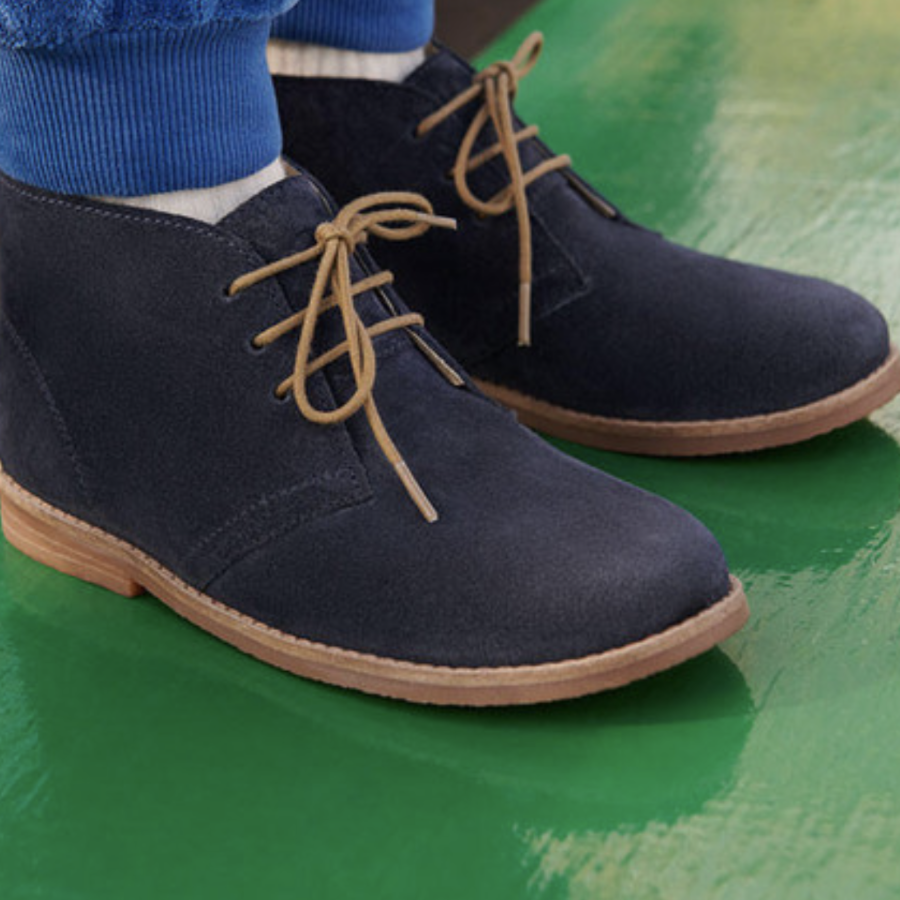 A desert boot by Start-Rite, style Autumn, in navy suede with light brown laces and soles. Side view of a pair.