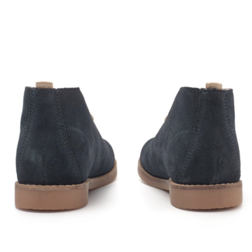 A desert boot by Start-Rite, style Autumn, in navy suede with light brown laces and soles. Rear view of a pair.