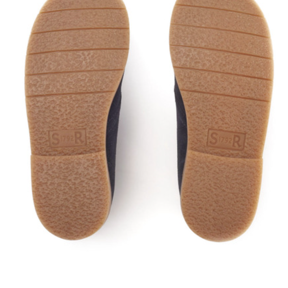 A desert boot by Start-Rite, style Autumn, in navy suede with light brown laces and soles. View of the soles of a pair.