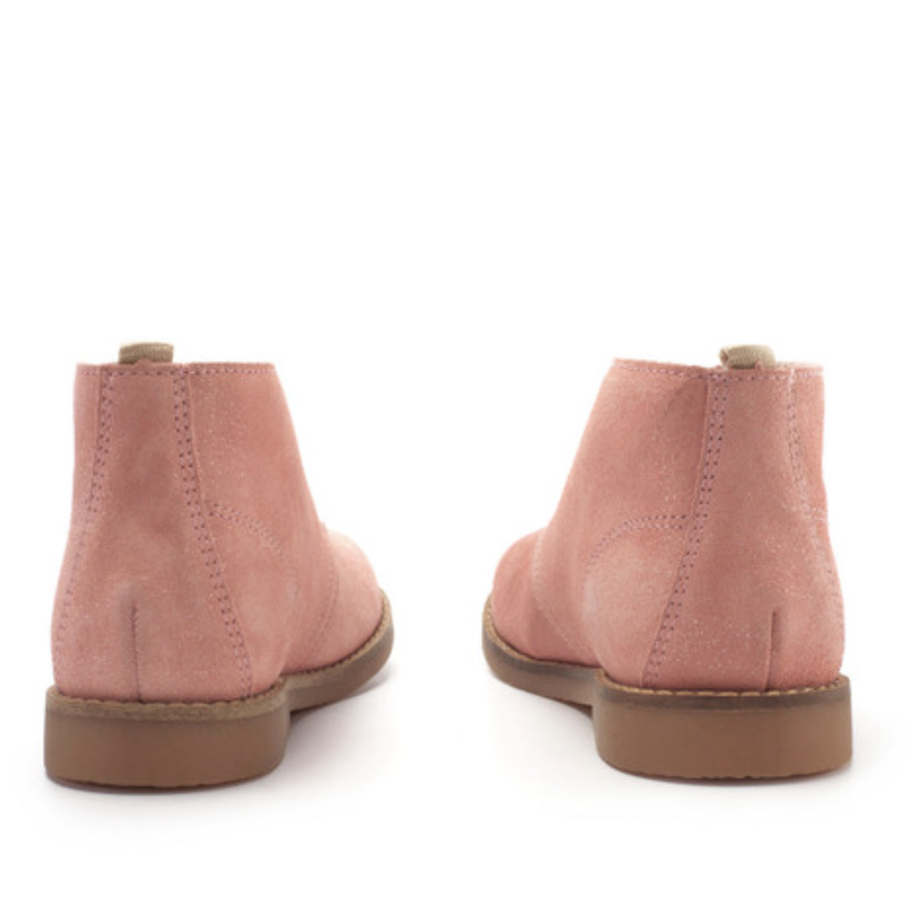 A girls desert boot by Start-Rite, style Autumn, in dusky pink glitter suede with light brown laces and soles. Rear view of a pair.