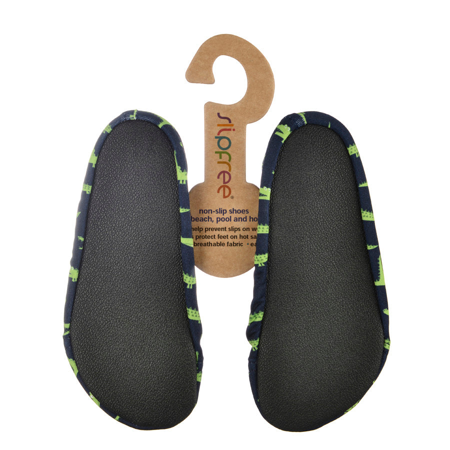 A boys non slip swim shoe by Slipfree, style Gator, in navy and green. Sole view.