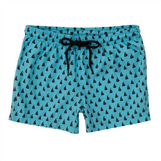 A pair of boys swim shorts by Slipfree, style Peter, in blue with black boats. Front view.