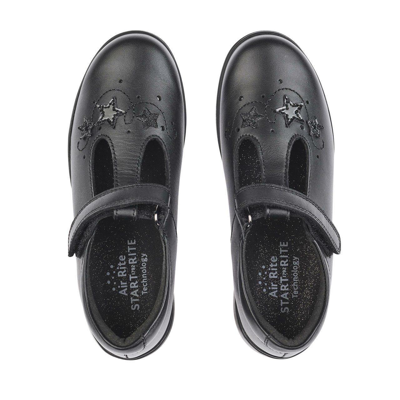 A pair of girls school shoes by Start Rite, style Star Jump, in black leather with star motif and velcro fastening. Above view.