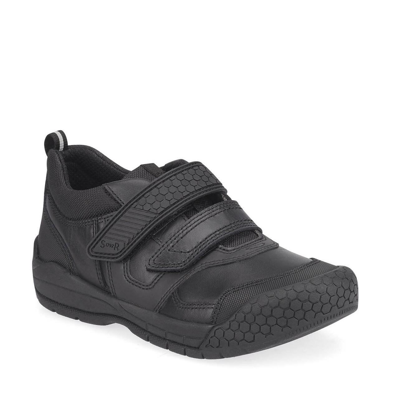 A pair of boys school shoes by Start Rite, style Strike, in black leather with double velcro fastening. Angled view.