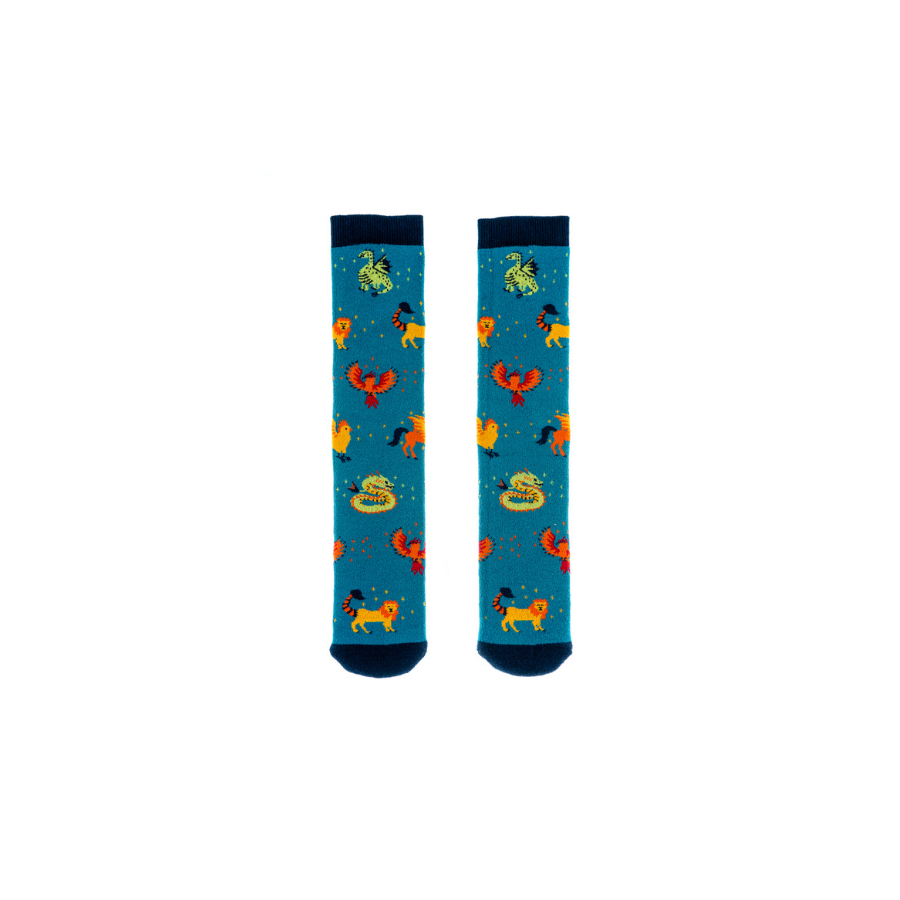 A pair of junior socks by Squelch, style Mystical Creatures, in blue multi. Front view.