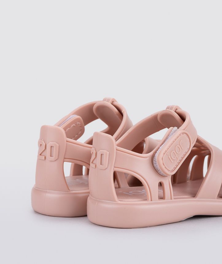 A girls jelly shoe by Igor, style Tobby Solid, in pink with a velcro strap. Back view.