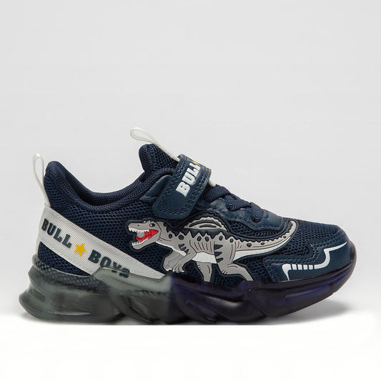 A boys trainer by Bull Boys, style Spinosauro, in navy blue with grey dinosaur in 3D and flashing sole. Velcro and elastic faux lace fastening. Right side view.