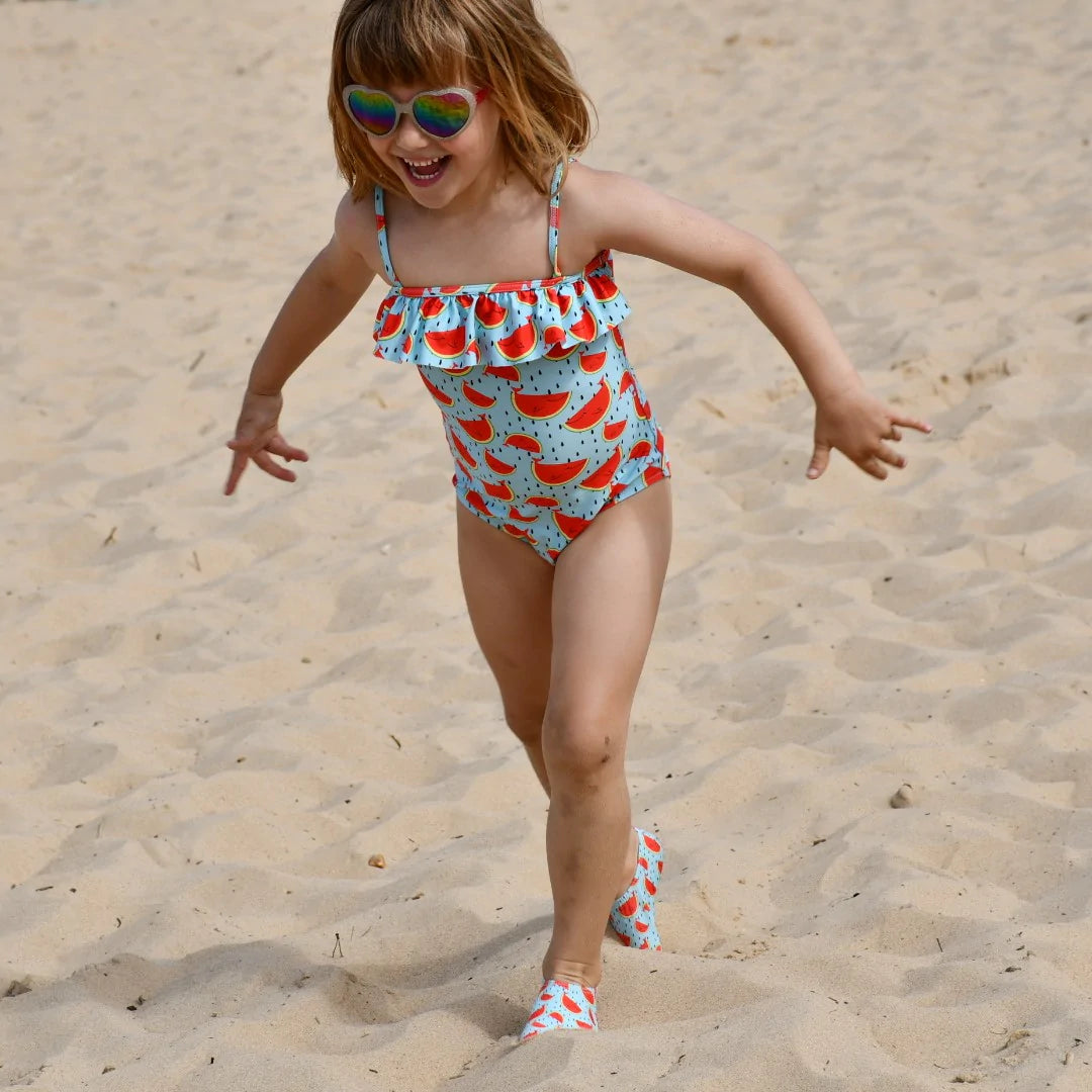 A girls swimsuit by Slipfree, style Watermelon, in light blue and orange.